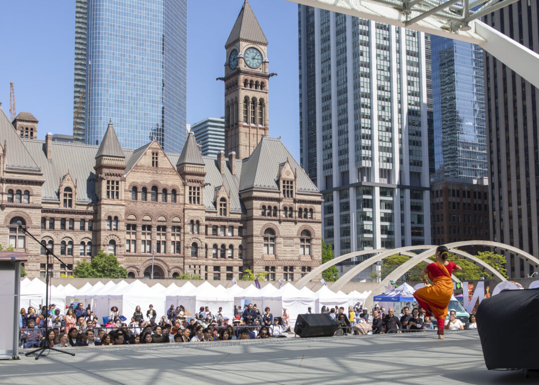 Woman dancing on stage in Nathan Phillips Square