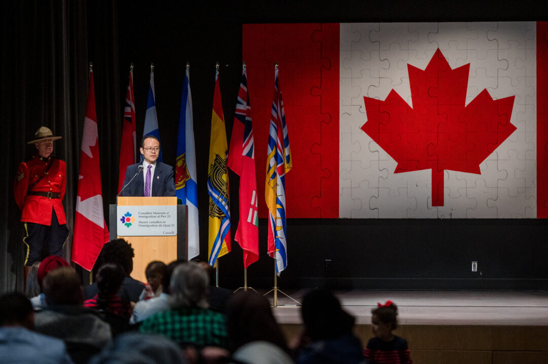 Photo of Wilber Huang speaking at a Canadian citizenship ceremony.